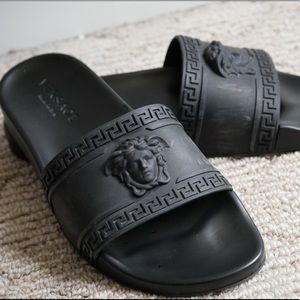 Pair of Black Versace slides from 2013.